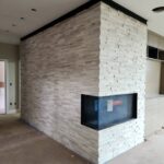 Decorative brick wall in a bathroom remodel – adding texture and charm to the space.