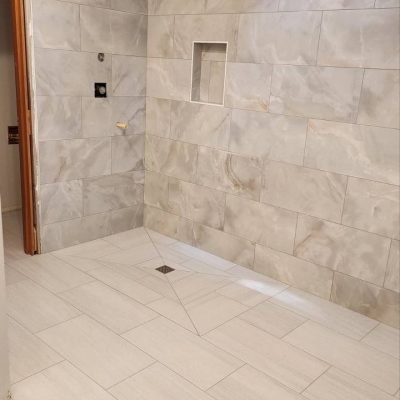 Shower area after renovation – sleek, modern design with high-end finishes.