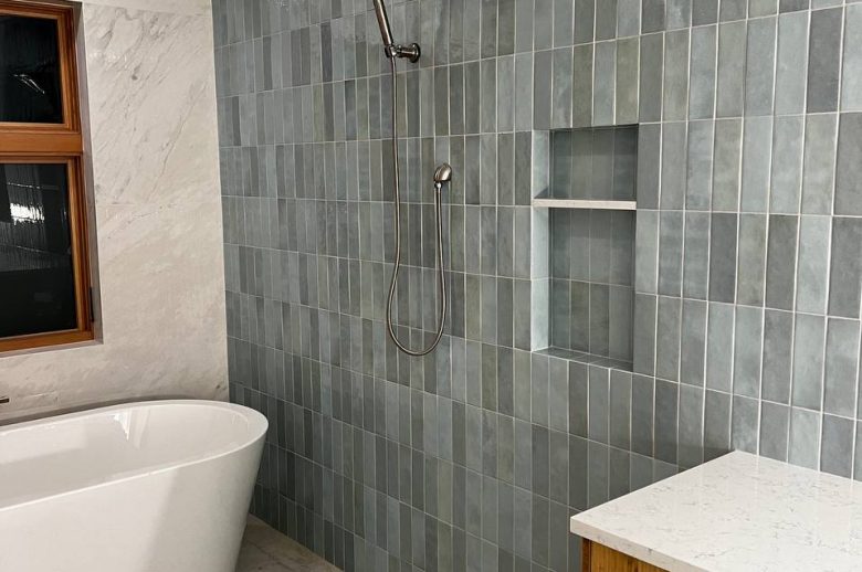 Wall tiles installed in the bathroom – creating a sleek and modern look.